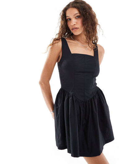 Ruched Sleeveless Mini Dress With Full Hem