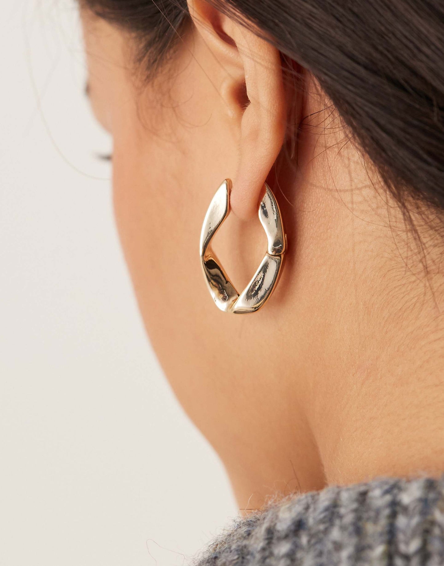 Hoop Earrings With Angular Twist Hinge Design