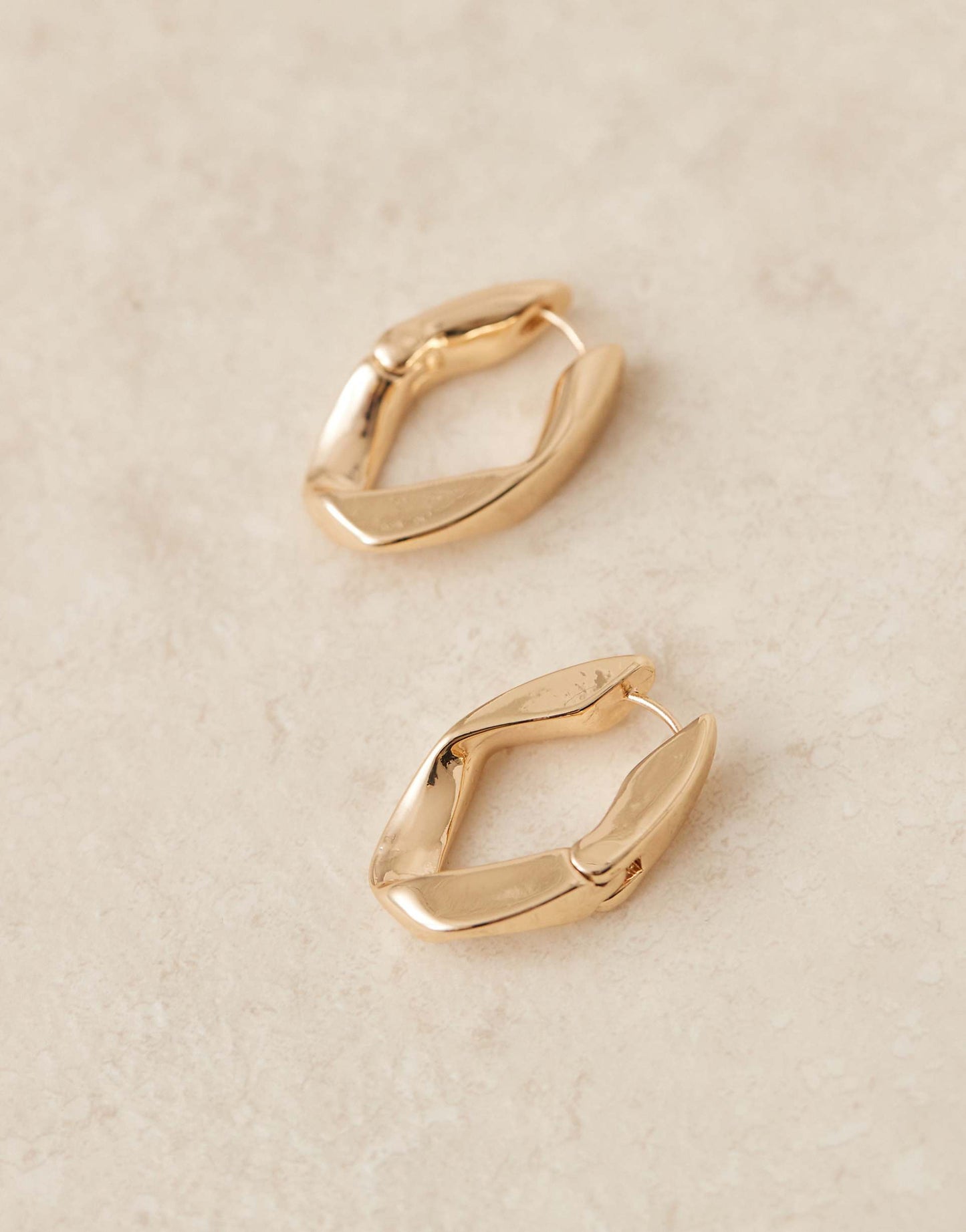 Hoop Earrings With Angular Twist Hinge Design