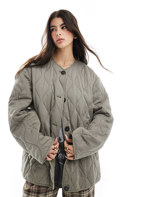 Dolphin Hem Collarless Quilted Jacket