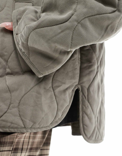 Dolphin Hem Collarless Quilted Jacket