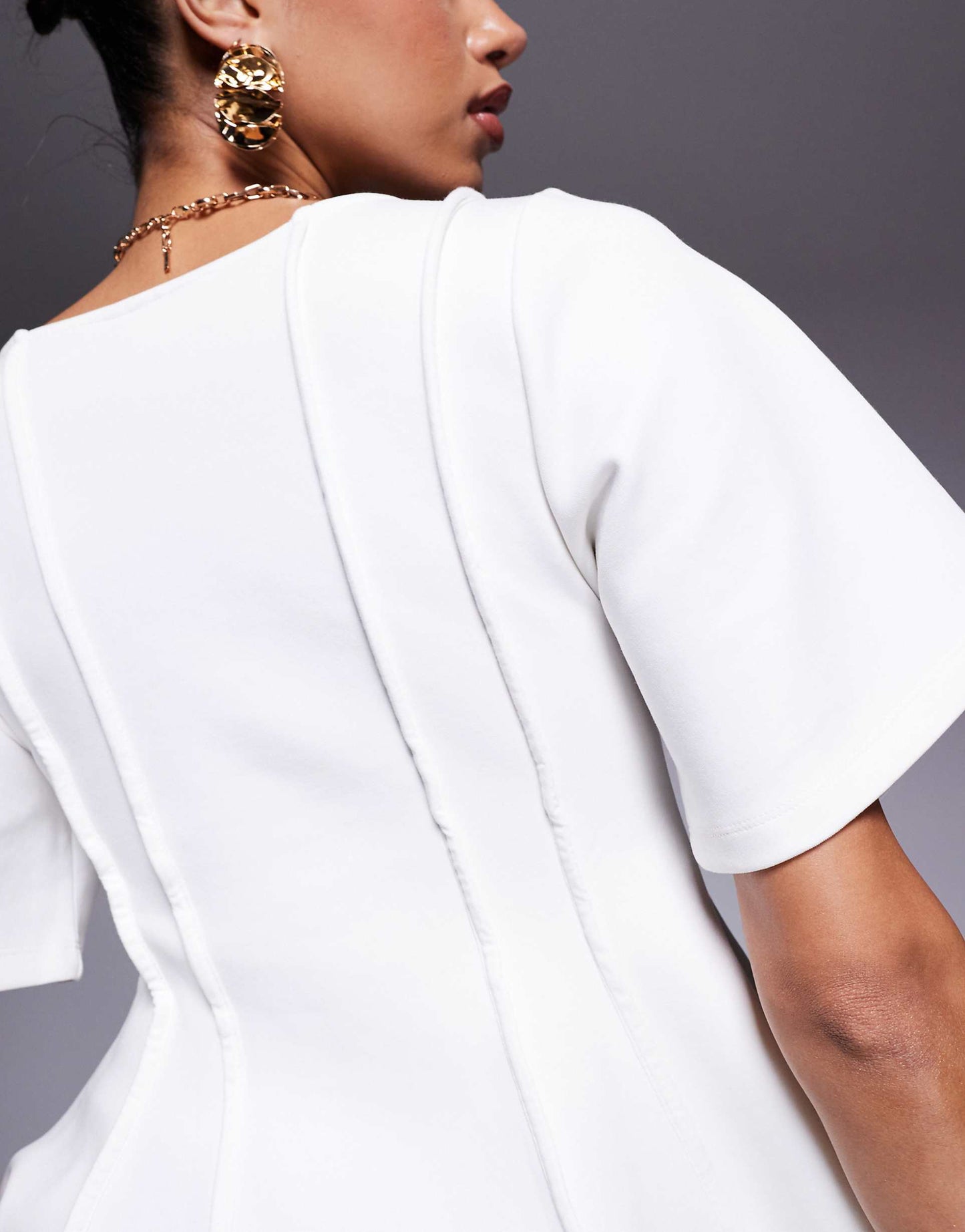 Exposed Seam Peplum Short Sleeve Top