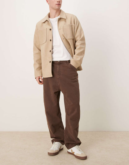 Skater Fit Jeans With Heavy Brown Wash