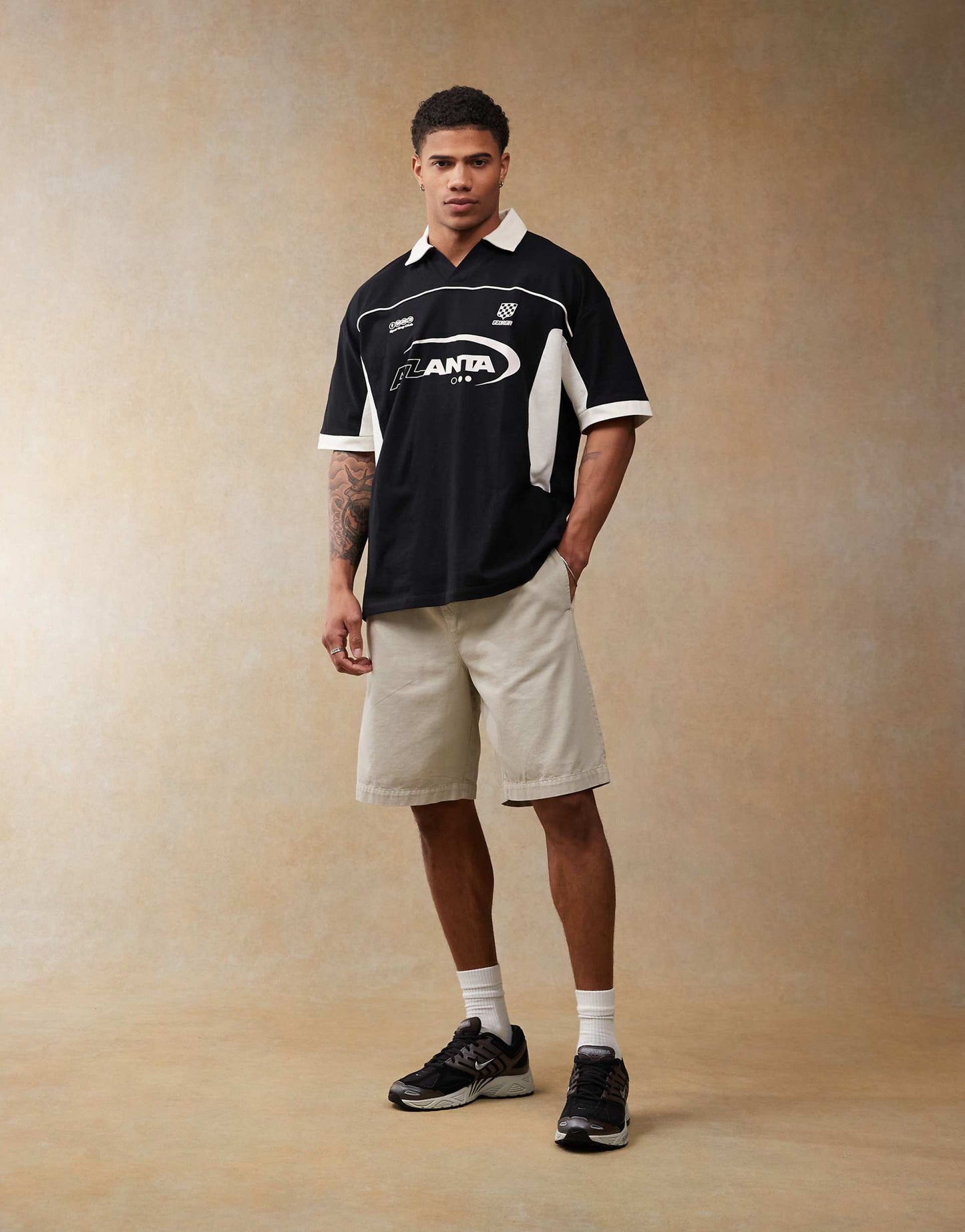 Oversized Polo With Cut And Sew Panelling And Sports Graphics