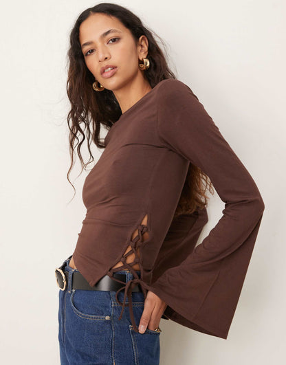 Flared Long Sleeve Asymmetric Top With Side Tie Detail